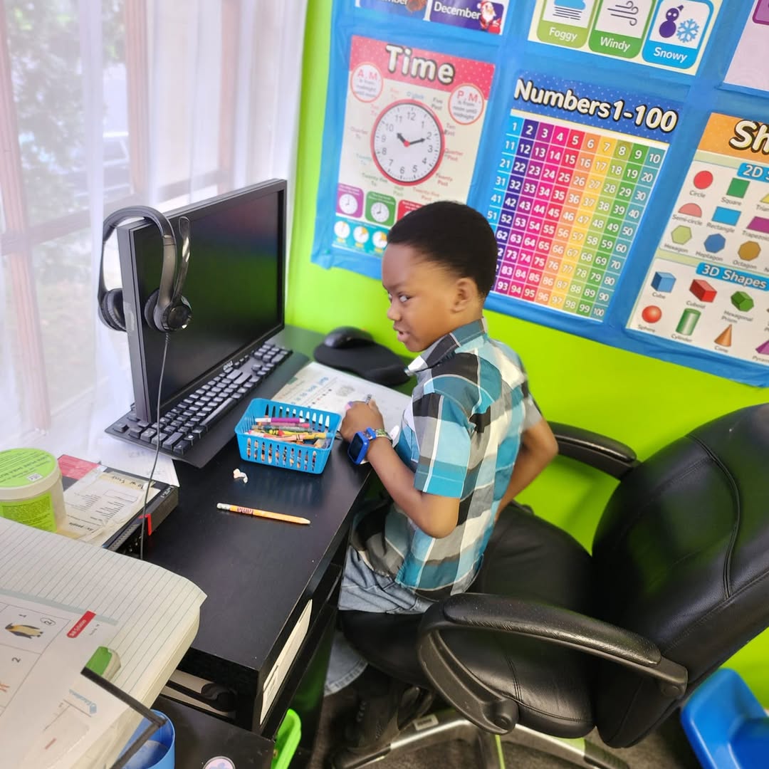 A student working at a desk in the Mission M-Pact room