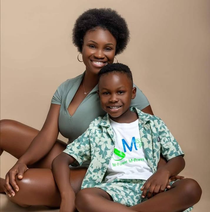 A parent and child in a portrait, the child wearing a Mission M-Pact shirt